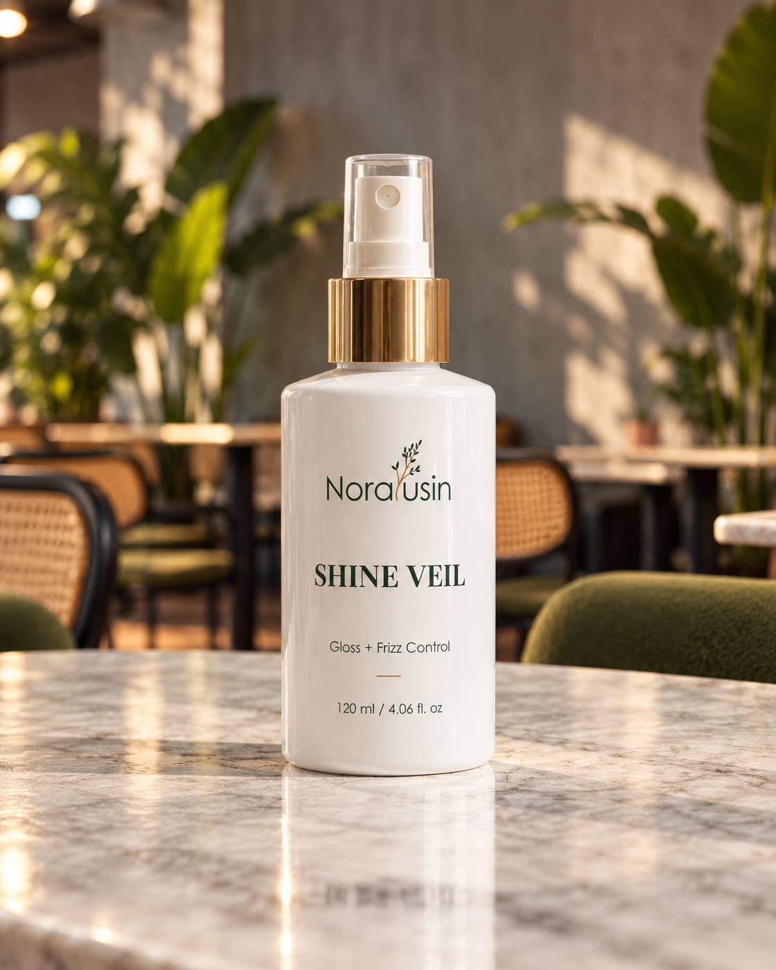 Shine Veil leave-in hair serum bottle on a marble café table